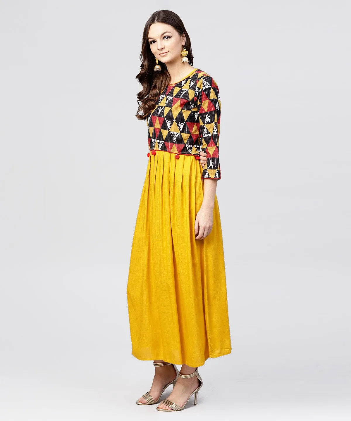 Bright Yellow rayon A-line box pleated Maxi with attached Jacket till Yoke and emblished with tassels